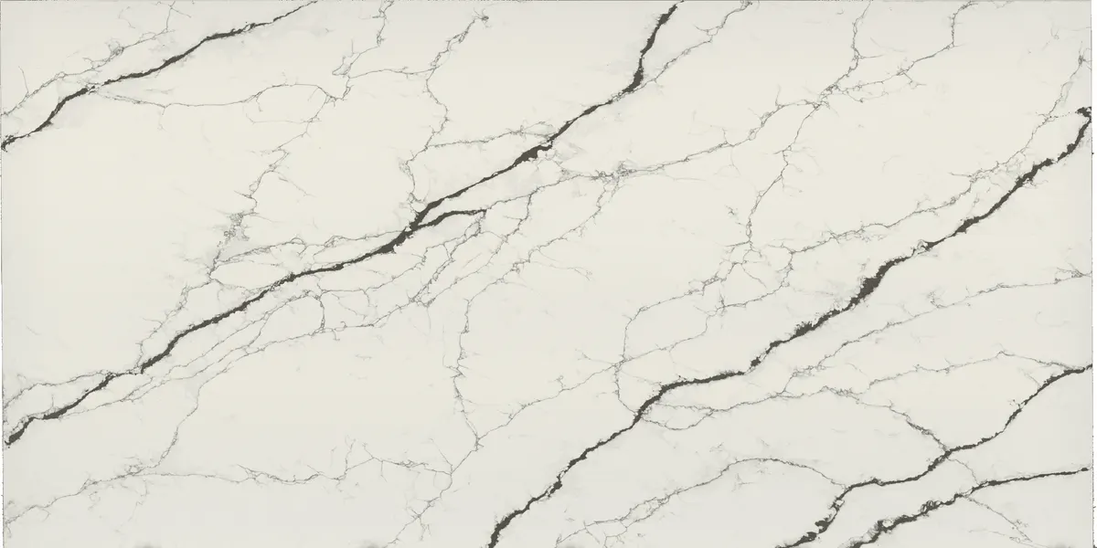 White quartz countertop slab with bold black diagonal veining resembling Calacatta marble