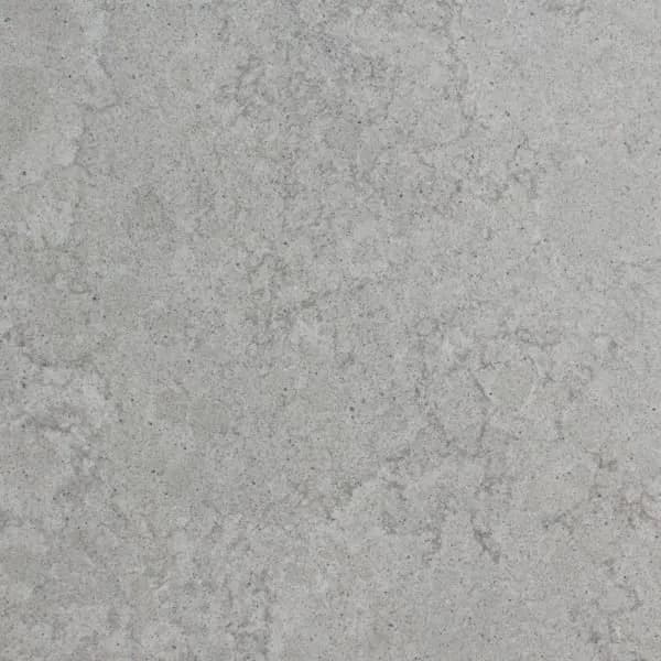 Light gray granite countertop with subtle white speckled veining, close-up texture