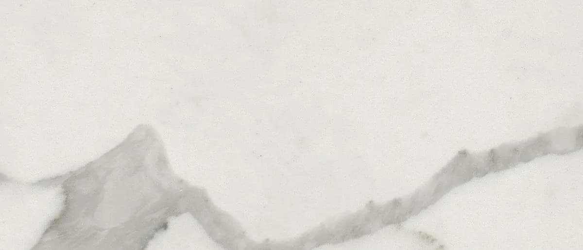 White marble countertop slab with soft gray diagonal veining