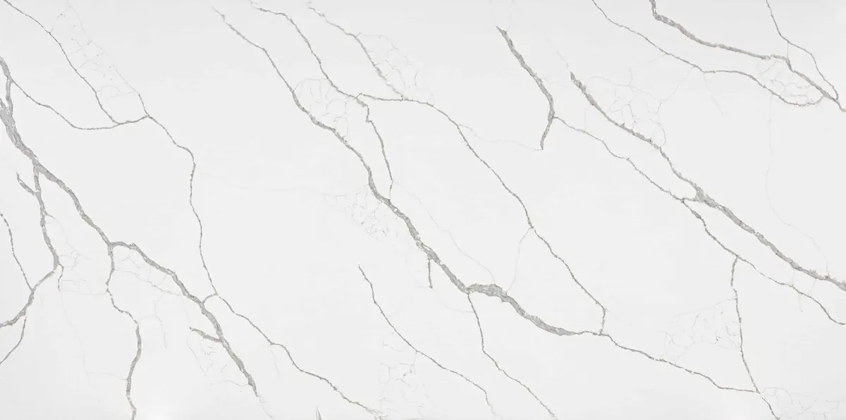 White quartz countertop with dramatic gray diagonal veining and sharp linework