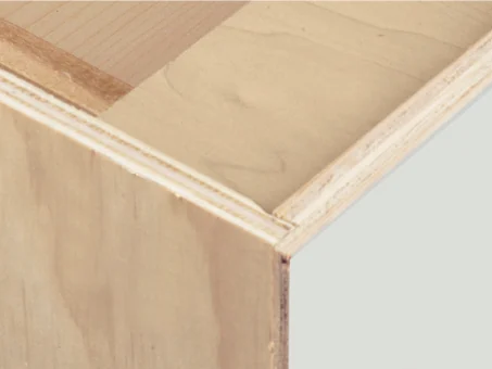 Close-up of a Mantra cabinet corner, showing the layers of its half-inch plywood end panel