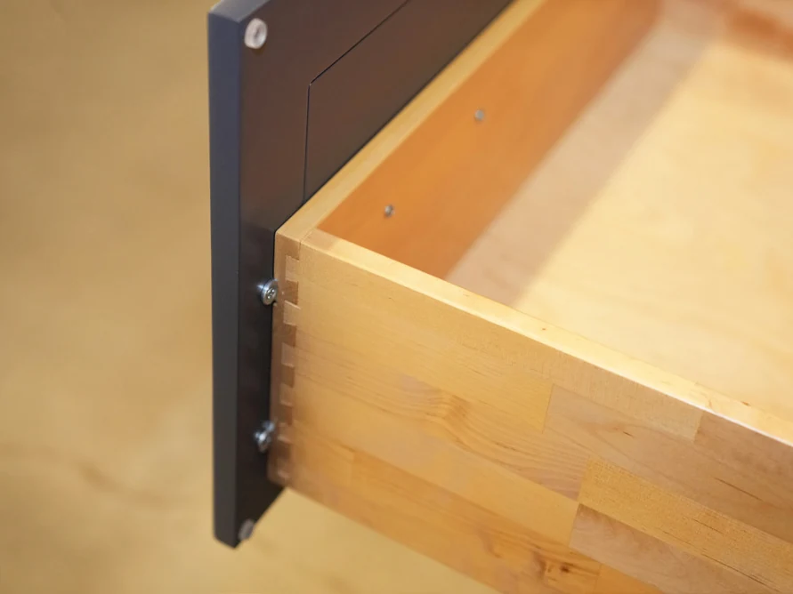 Corner of a Fabuwood solid wood drawer box, with interlocking dovetail joints
