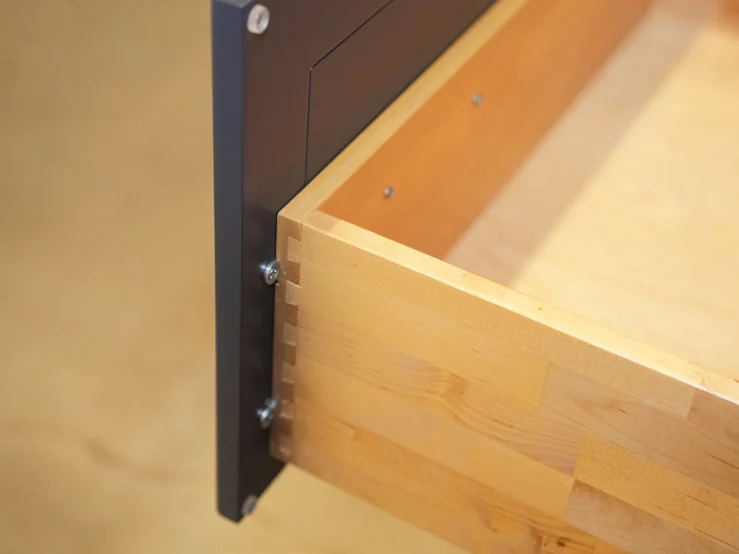 Corner of a Fabuwood solid wood drawer box, with interlocking dovetail joints